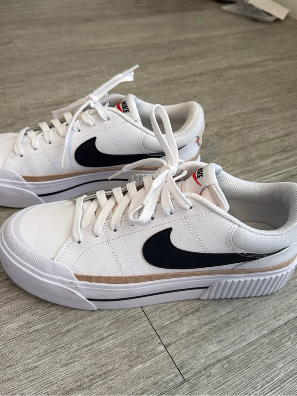 Nike Women’s White Sneakers with Black Swoosh and Beige Trim